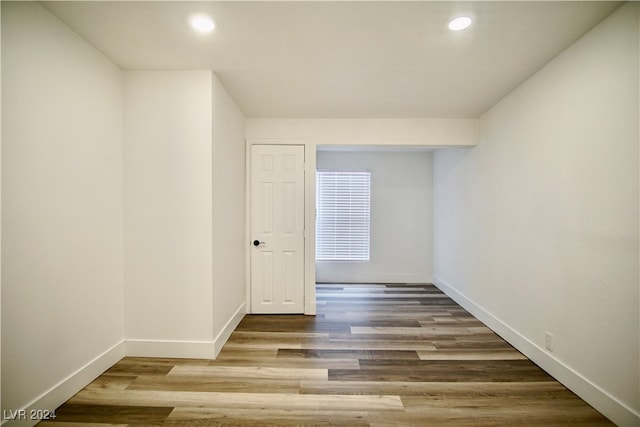 spare room with wood-type flooring