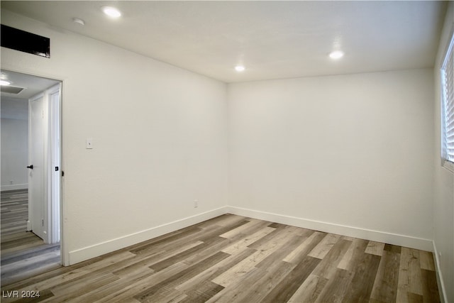 spare room featuring light hardwood / wood-style floors