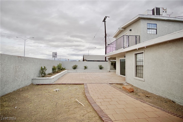 view of yard with a patio and central AC unit