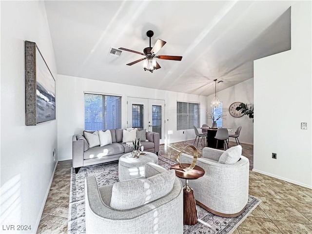 tiled living room featuring french doors, lofted ceiling, visible vents, a ceiling fan, and baseboards