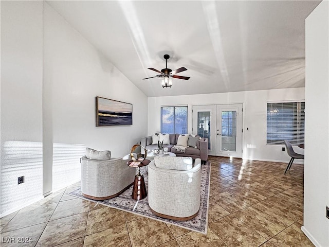 living area featuring lofted ceiling, ceiling fan, tile patterned flooring, and french doors