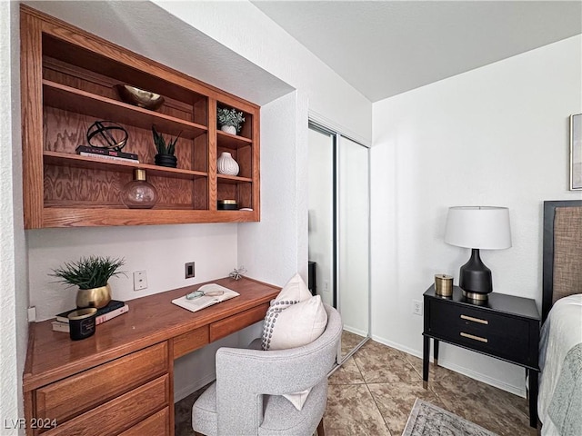 office area featuring baseboards and built in study area