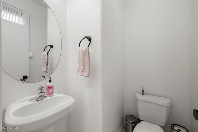 bathroom featuring sink and toilet