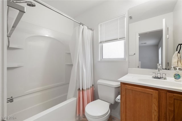 full bathroom featuring vanity, shower / tub combo, and toilet