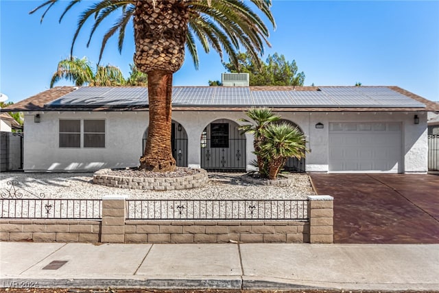 ranch-style house featuring a garage