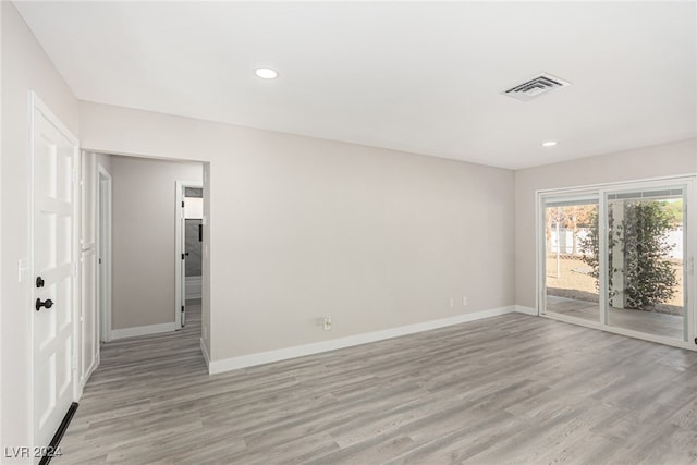 unfurnished room featuring light wood-type flooring