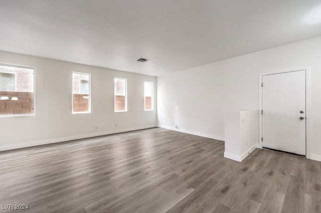 unfurnished room featuring hardwood / wood-style flooring