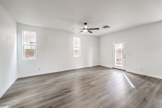 spare room featuring hardwood / wood-style floors and ceiling fan