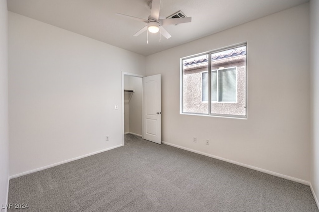 unfurnished bedroom featuring carpet flooring and ceiling fan