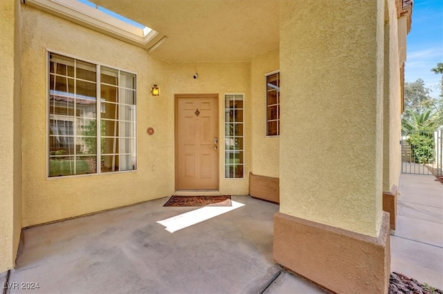 doorway to property featuring a patio