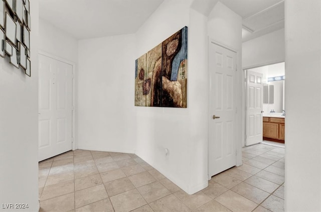 corridor featuring light tile patterned flooring