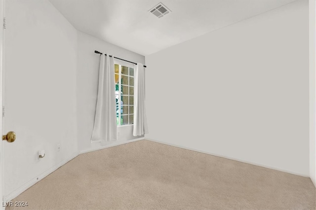 empty room with carpet flooring