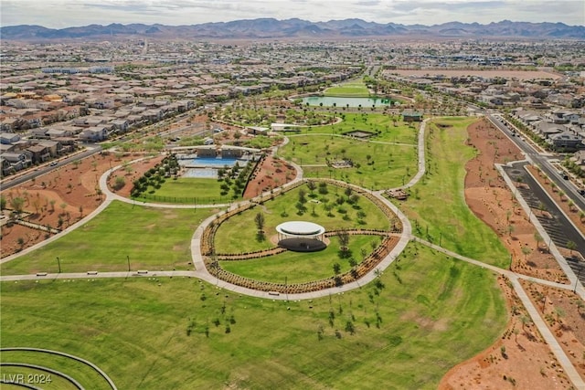 birds eye view of property featuring a water and mountain view