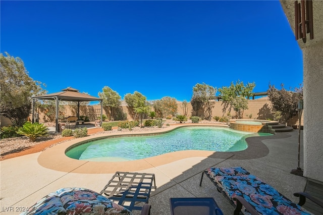 view of swimming pool featuring a fenced backyard, a patio, and a gazebo