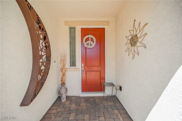 property entrance featuring stucco siding