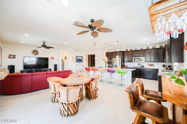 dining space featuring ceiling fan and recessed lighting