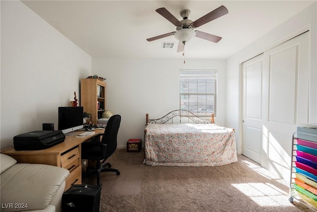 carpeted bedroom with ceiling fan and visible vents