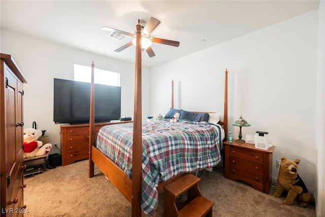 bedroom with ceiling fan, visible vents, and light colored carpet