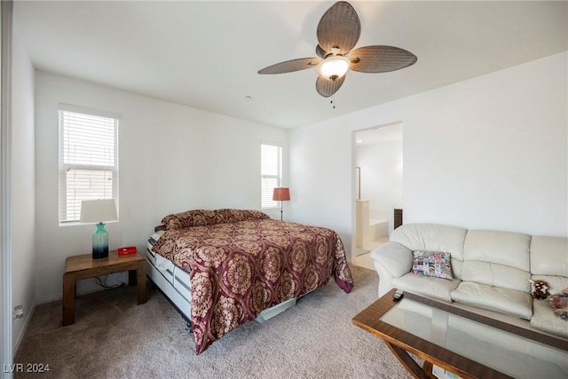 bedroom with carpet, ceiling fan, and ensuite bathroom