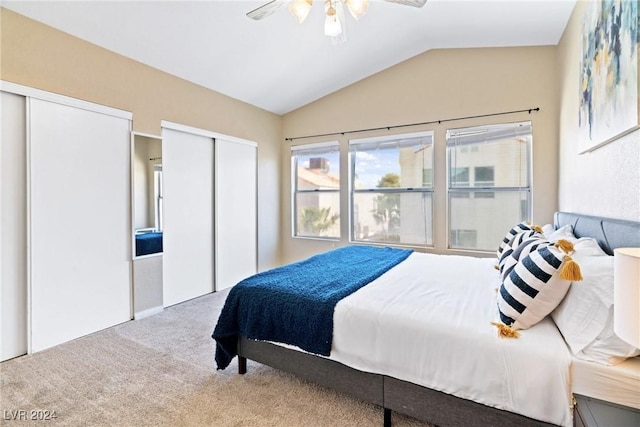 8213 Grassy Point Cir, Las Vegas, NV 89145 - bedroom with multiple closets, vaulted ceiling, carpet flooring, and ceiling fan