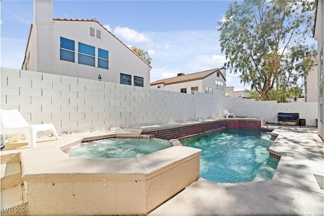 8213 Grassy Point Cir, Las Vegas, NV 89145 - view of swimming pool featuring a fenced backyard, a patio, and a pool with connected hot tub
