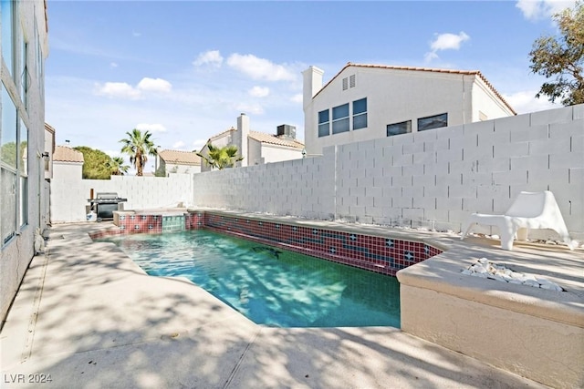 8213 Grassy Point Cir, Las Vegas, NV 89145 - view of swimming pool featuring a patio area and a fenced backyard