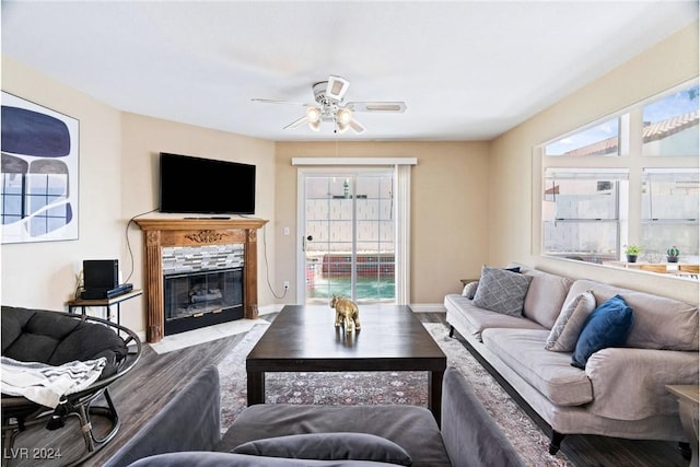 8213 Grassy Point Cir, Las Vegas, NV 89145 - living area with a ceiling fan and a fireplace with flush hearth