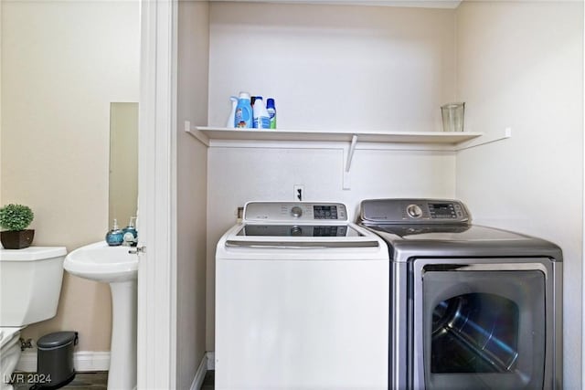 8213 Grassy Point Cir, Las Vegas, NV 89145 - washroom featuring washer and dryer and a sink