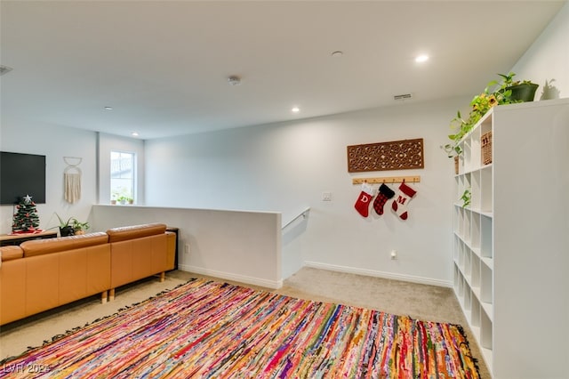 living room featuring light carpet