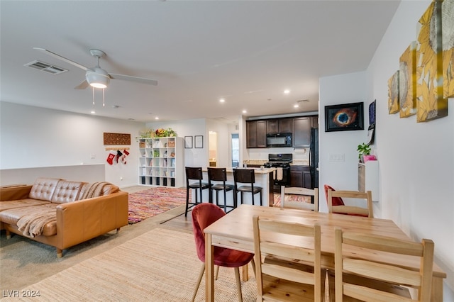 dining room featuring ceiling fan