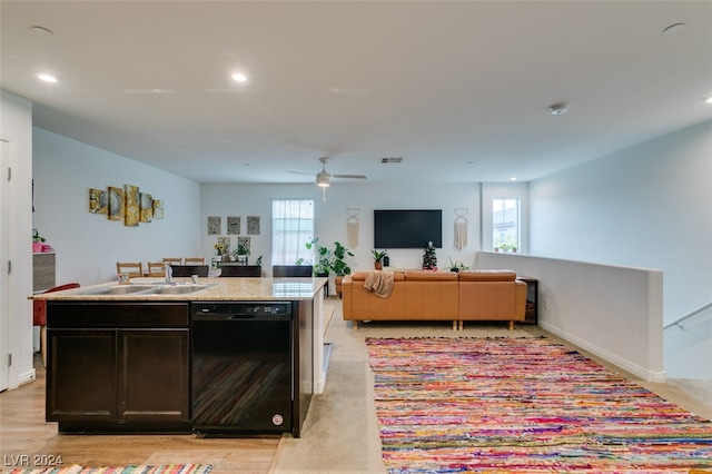 kitchen with ceiling fan, sink, a center island with sink, dishwasher, and light hardwood / wood-style floors