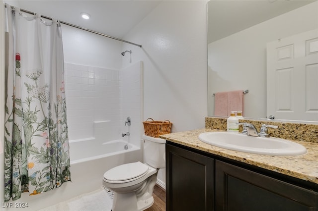 full bathroom with hardwood / wood-style floors, vanity, toilet, and shower / tub combo with curtain