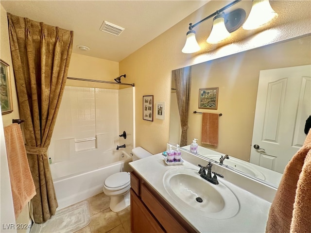 full bathroom with toilet, vanity, tile patterned floors, and tub / shower combination