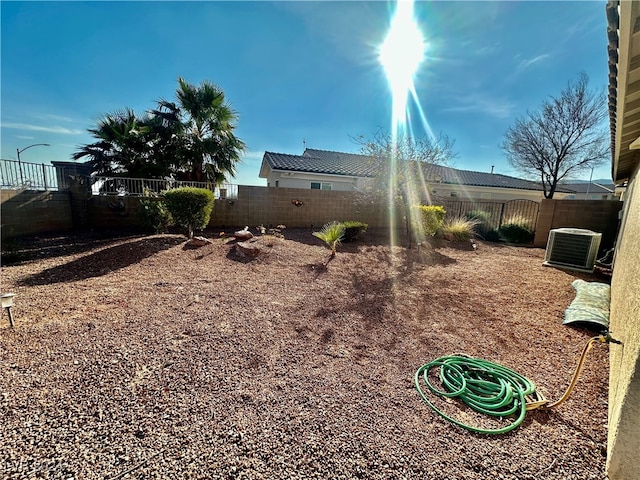 view of yard with central AC