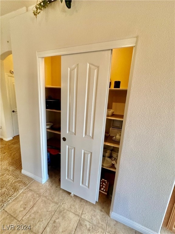 interior space featuring tile patterned flooring