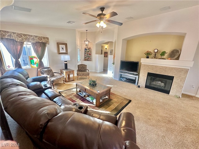 carpeted living room featuring ceiling fan