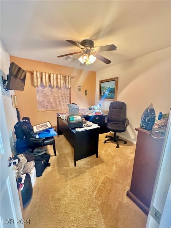 carpeted office with ceiling fan