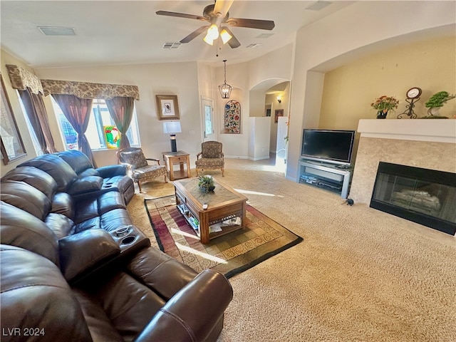 carpeted living room featuring ceiling fan and lofted ceiling