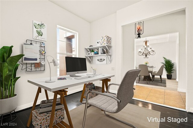 office featuring wood-type flooring and a notable chandelier