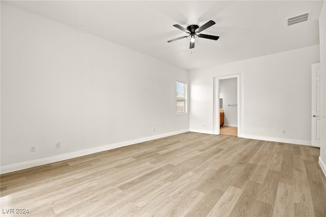 unfurnished bedroom featuring ensuite bath, ceiling fan, and light hardwood / wood-style flooring