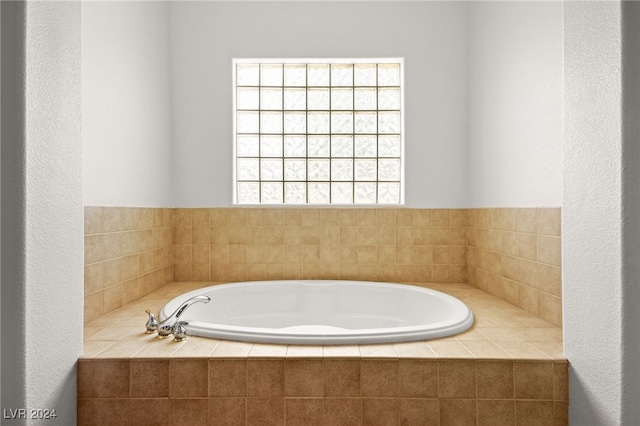 bathroom with tiled bath