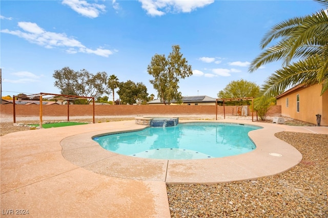 view of pool with a pergola and a patio area