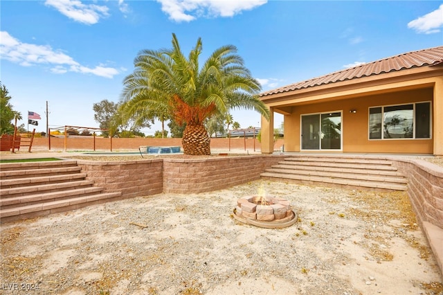 view of yard featuring an outdoor fire pit