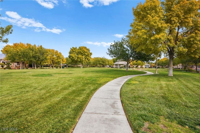 view of property's community with a gazebo and a yard