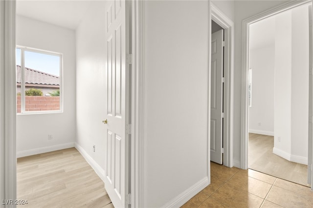 corridor featuring light hardwood / wood-style floors