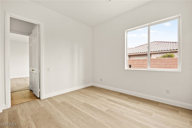 spare room with light hardwood / wood-style flooring