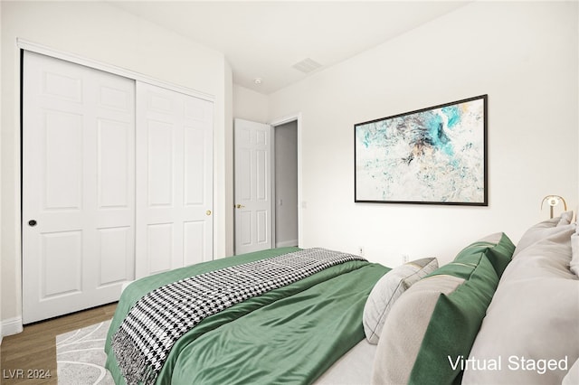 bedroom with a closet and wood-type flooring