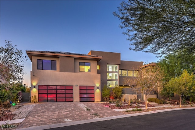 view of front of property with a garage