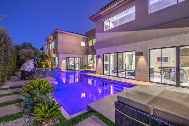 view of swimming pool featuring a patio area