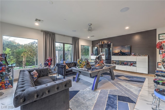 living room with ceiling fan and french doors